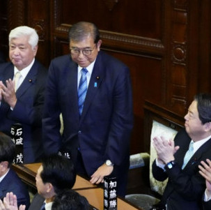 Japan’s PM retains post, though shares...